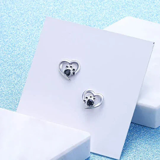 Nina - cardiac paw earpluged with black silver